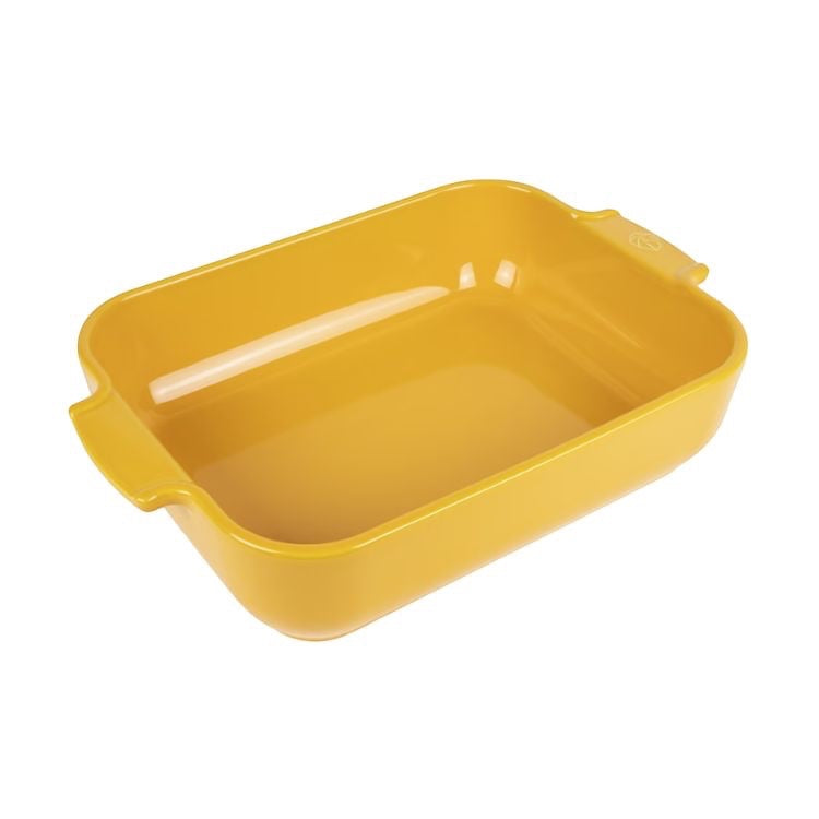 Eclectic Appolia rectangular ceramic oven dish in saffron yellow with wide ribbed handles for easy serving.