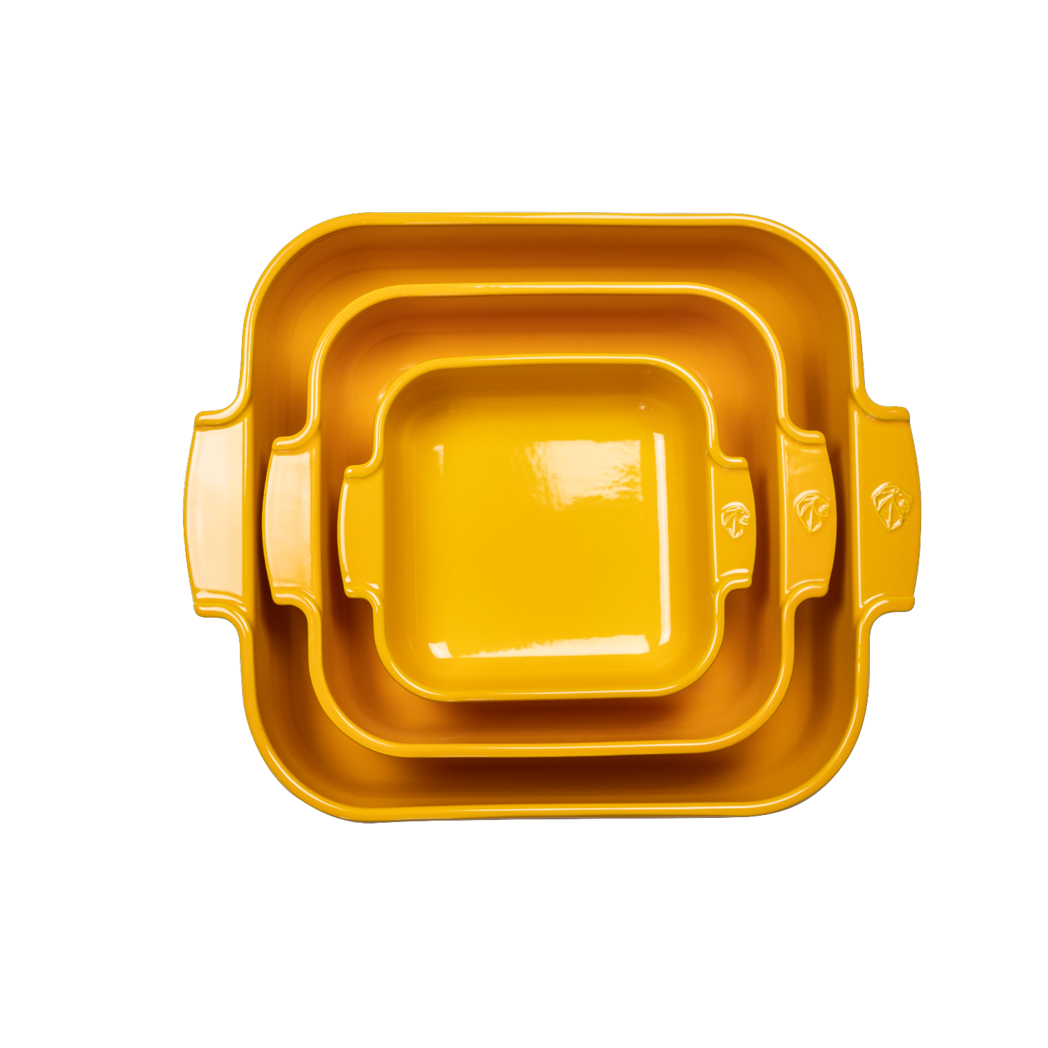 Eclectic Appolia square ceramic oven dishes in saffron yellow, nested together to show three different sizes.
