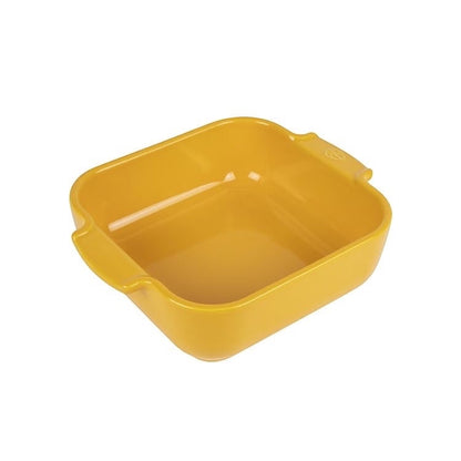 Eclectic Appolia square ceramic oven dish in vibrant saffron yellow with wide ribbed handles for easy serving.