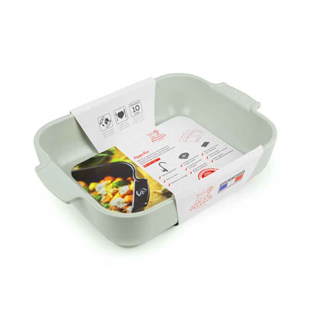 Eclectic Appolia rectangular ceramic oven dish in sage green with ribbed handles and product information label.
