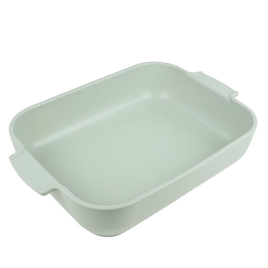 Eclectic Appolia rectangular ceramic oven dish in a soft sage green glaze with wide ribbed handles.