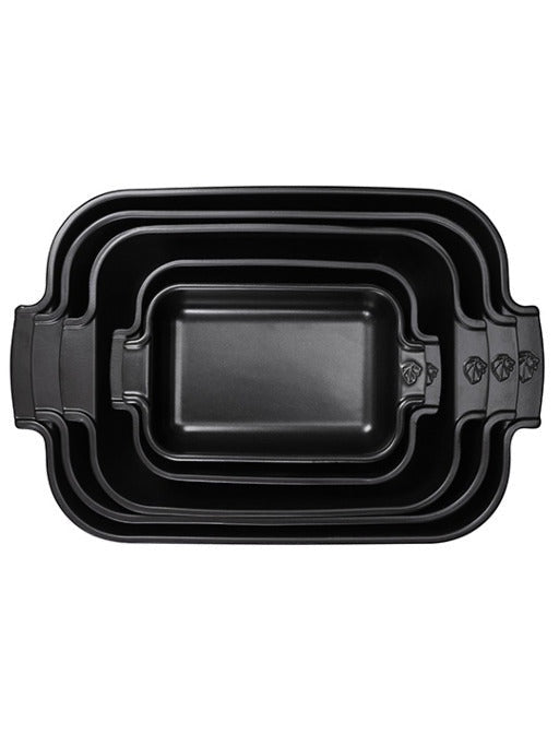 Eclectic Appolia rectangular ceramic oven dishes in satin black, featuring a stackable design with ribbed handles.