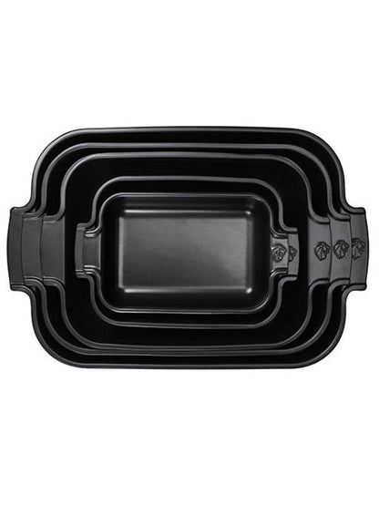 Eclectic Appolia rectangular ceramic oven dishes in satin black, featuring a stackable design with ribbed handles.