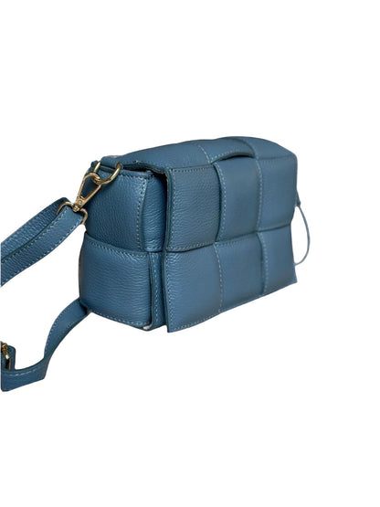 Eclectic Aria blue quilted leather box crossbody bag with gold-tone hardware and woven padded texture