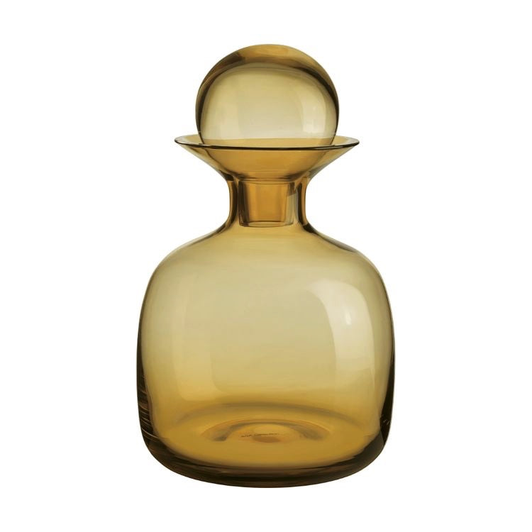 Eclectic ASA Selection Sarabi amber mouth-blown glass carafe with a spherical stopper and rounded silhouette.
