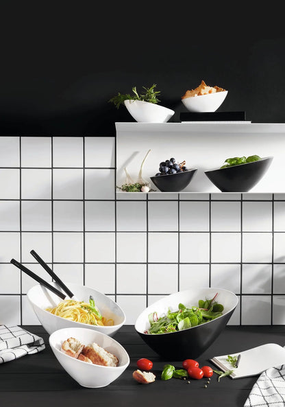 Eclectic ASA Selection ivory white porcelain bowl with a modern asymmetric design displayed in a kitchen setting