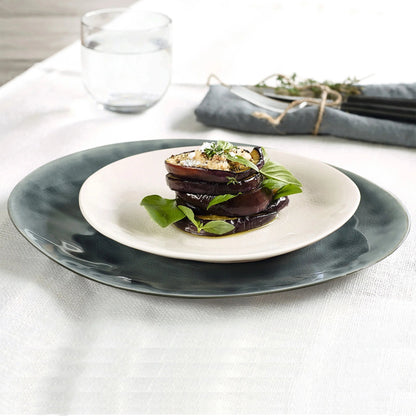 Eclectic ASA Selection À La Maison champagne ceramic stoneware bowl with craquelure glaze holding a stack of eggplant