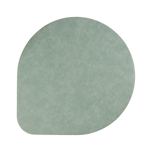 Eclectic ASA Selection spearmint vegan leather placemat with a soft matte finish and organic shape