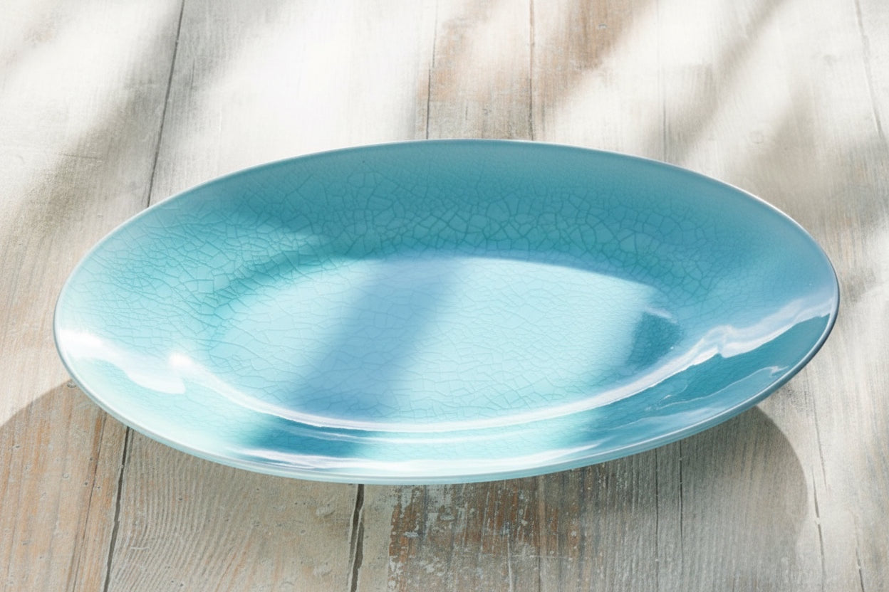 Eclectic ASA Selection A La Plage oval serving bowl in turquoise with a distinctive crackle glaze finish.