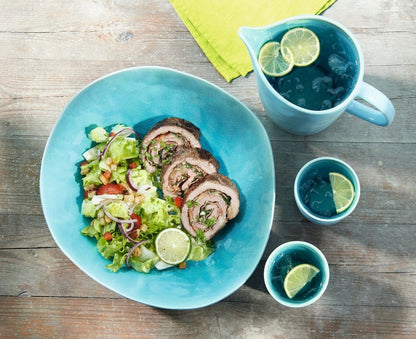 Eclectic ASA Selection A La Plage turquoise oval serving bowl with crackle glaze texture filled with salad and meat