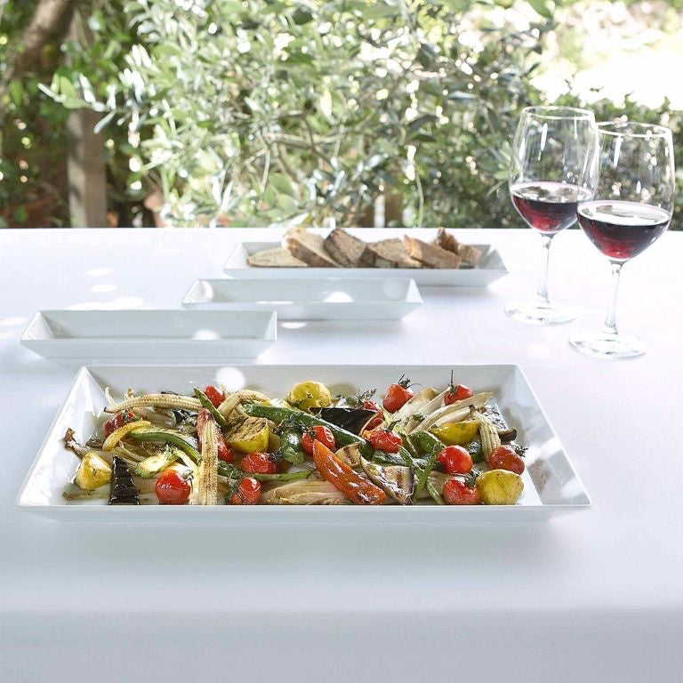 Eclectic ASA Selection white porcelain square serving platter filled with roasted vegetables on a dining table