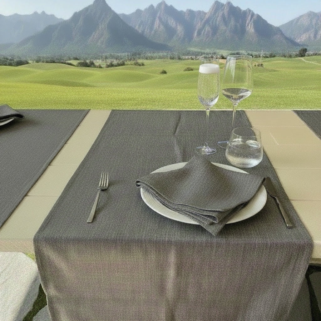 Eclectic ash grey linen-look polyester table runner set on an outdoor dining table with mountain views