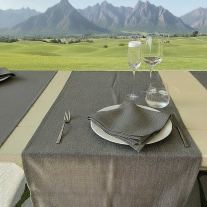 Eclectic ash grey linen-look polyester table runner set on an outdoor dining table with mountain views