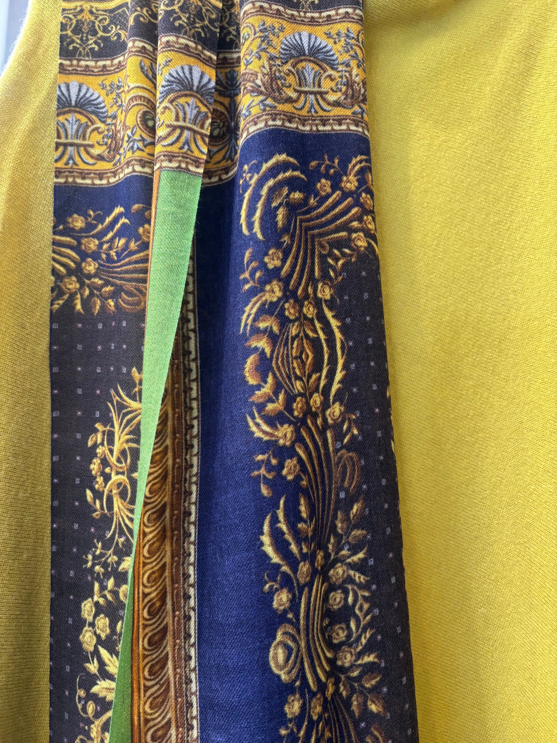 Eclectic baroque cashmere blend wrap scarf in navy, gold, and olive green with intricate scroll and floral patterns.