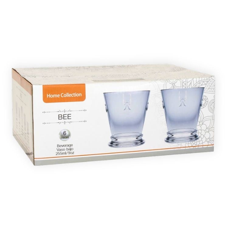 Eclectic set of 6 clear glass water tumblers featuring an embossed bee motif in retail packaging