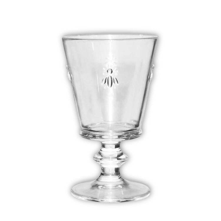Eclectic clear glass wine tumbler featuring a delicate embossed bee motif and a classic pedestal base design.