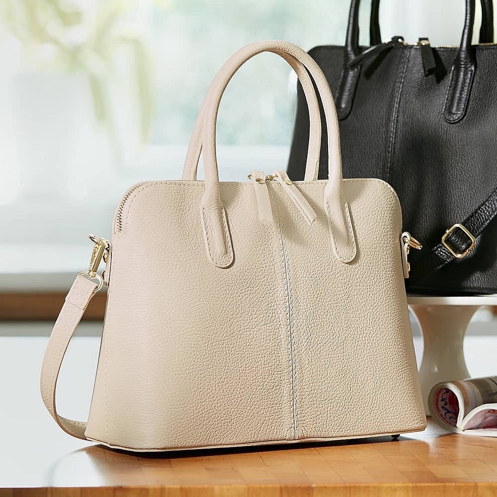 Eclectic Bella structured cream Italian leather handbag with silver hardware, top handles, and shoulder strap.