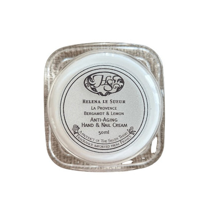 Eclectic Bergamot & Lemon hand and nail cream in a square double-walled Perspex jar with a silver finish.