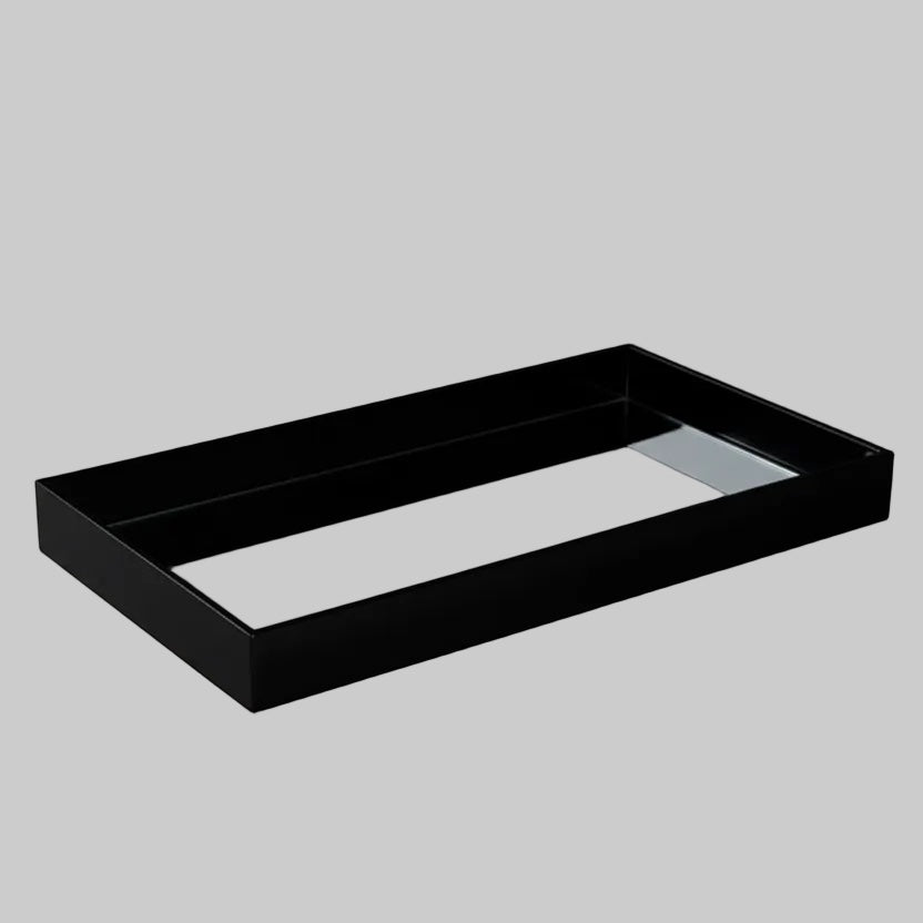 Eclectic black acrylic rectangular display tray with a polished mirrored base for elegant home decor styling.