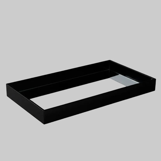 Eclectic black acrylic rectangular display tray with a polished mirrored base for elegant home decor styling.