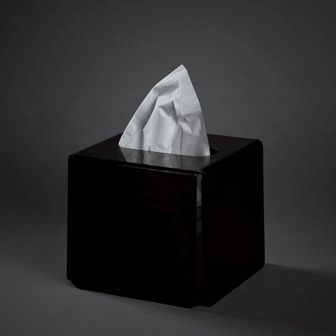 Eclectic modern square black acrylic tissue box cover with a sleek glossy finish on a dark background