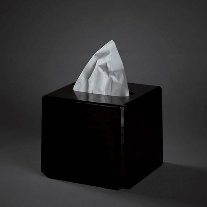 Eclectic modern square black acrylic tissue box cover with a sleek glossy finish on a dark background