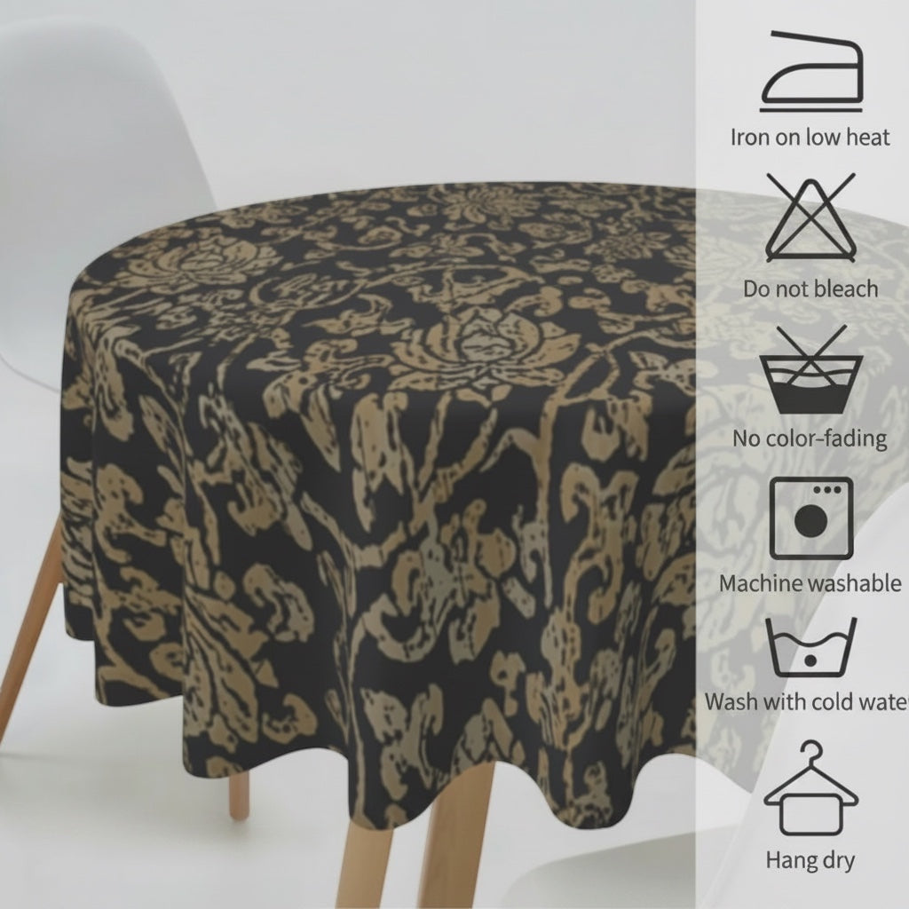 Eclectic round black and gold baroque tablecloth draped over a table with care instruction icons displayed on the side.