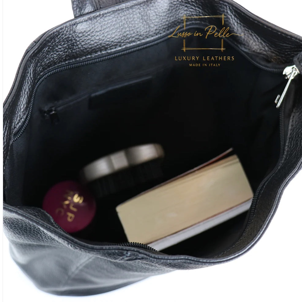 Eclectic black Italian pebbled leather backpack interior showing spacious compartment with zip and slip pockets