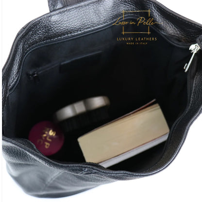 Eclectic black Italian pebbled leather backpack interior showing spacious compartment with zip and slip pockets
