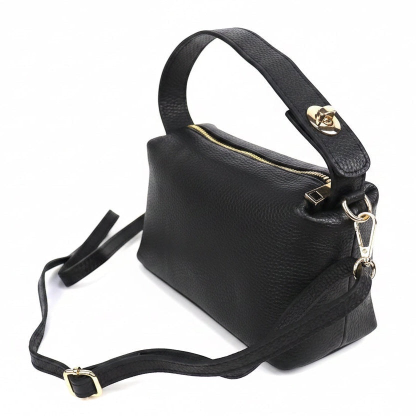 Eclectic black pebbled leather top handle crossbody bag with gold-tone hardware and twist-lock detail.