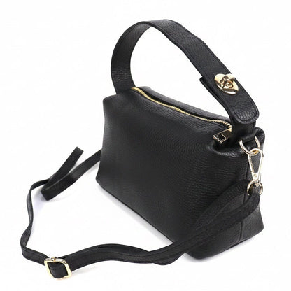 Eclectic black pebbled leather top handle crossbody bag with gold-tone hardware and twist-lock detail.