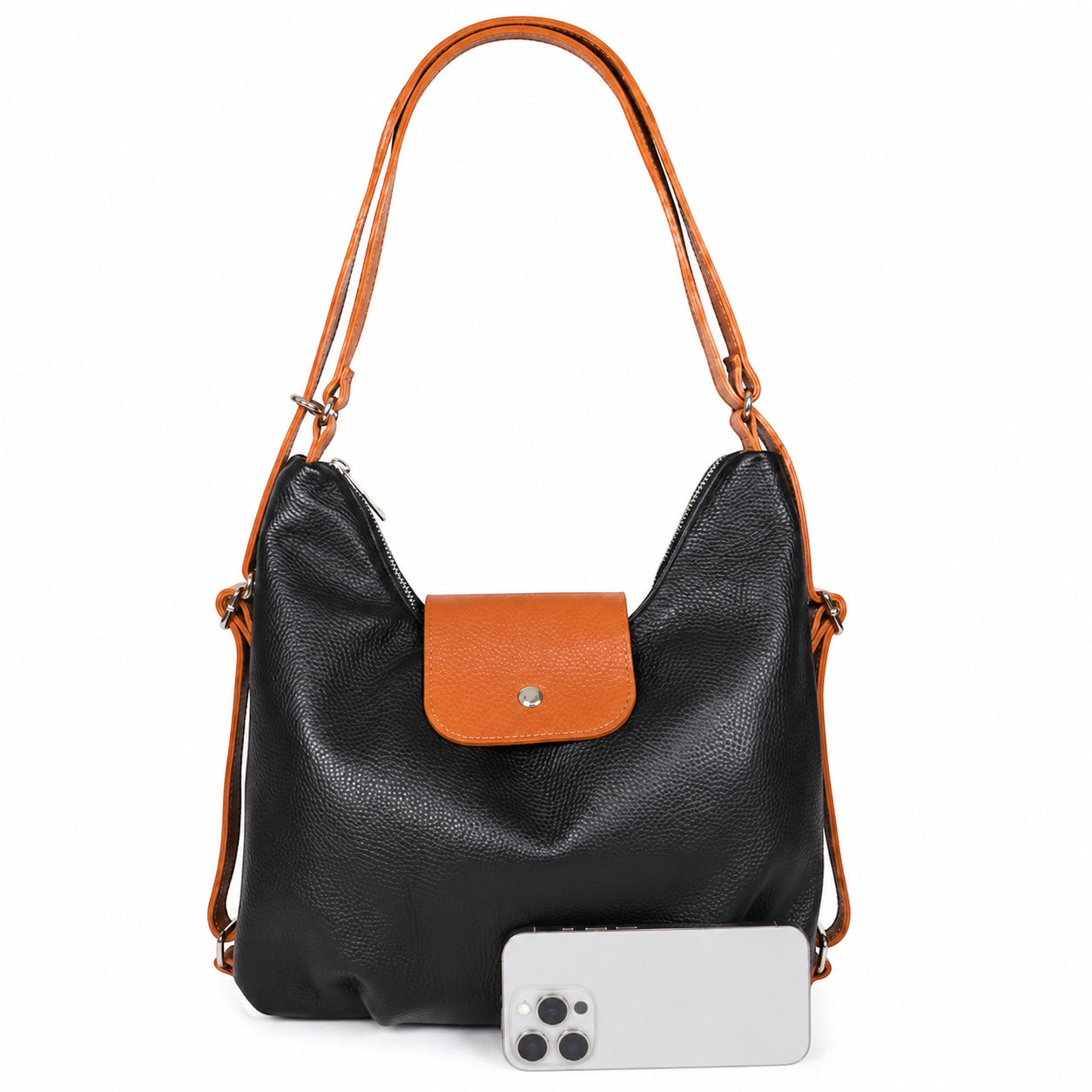 Eclectic black and tan grain leather convertible bag with adjustable straps and silver hardware on a white background.