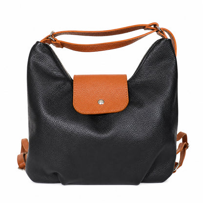 Eclectic black and tan grain leather convertible bag with silver hardware and adjustable straps