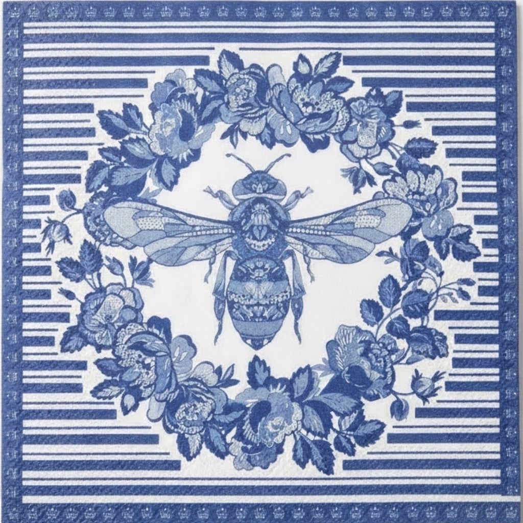 Eclectic blue and white disposable napkin featuring a detailed bee and botanical wreath print on linen-feel paper.