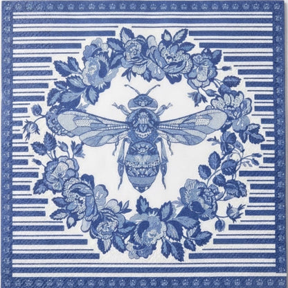Eclectic blue and white disposable napkin featuring a detailed bee and botanical wreath print on linen-feel paper.