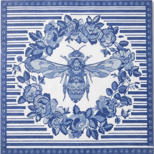 Eclectic blue and white disposable napkin featuring a detailed bee and botanical wreath print on linen-feel paper.