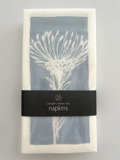Eclectic pack of 25 blue and white airlaid disposable napkins featuring a botanical pincushion flower print.