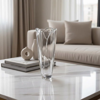 Eclectic Bohemia Globus clear crystal glass vase with a sculptural faceted silhouette on a marble coffee table.