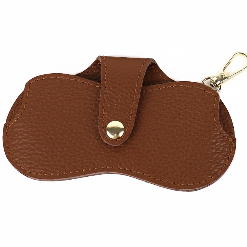 Eclectic brown leather glasses case with a gold-tone snap button and clip for attaching to handbags.