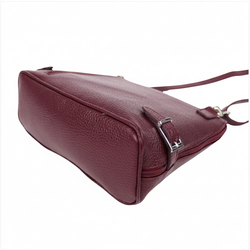 Eclectic Capri burgundy grained leather crossbody bag with silver side buckle detail and adjustable strap