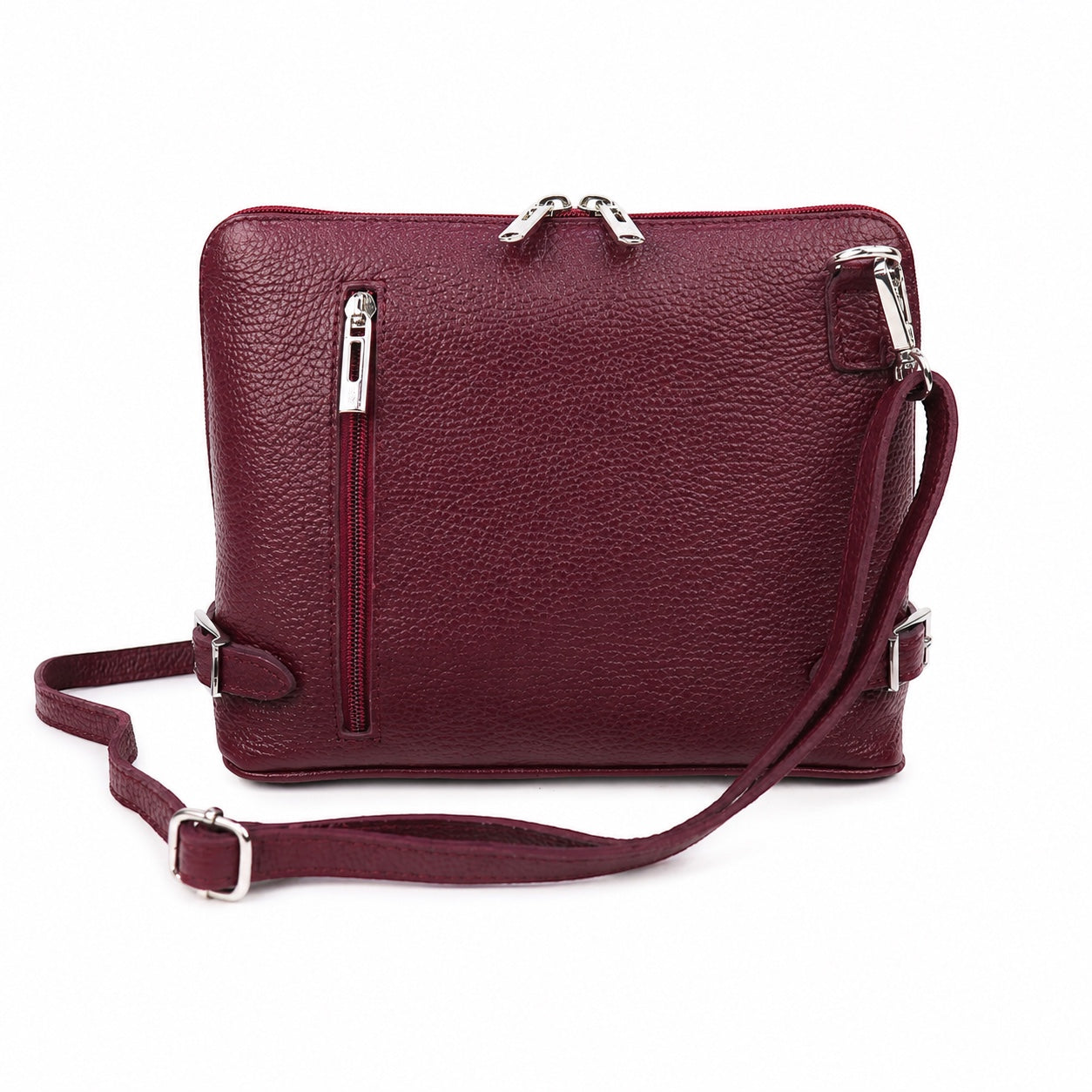 Eclectic burgundy grained leather crossbody bag with silver hardware, side buckles, and rear zip pocket.