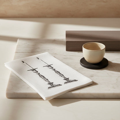 Eclectic Candlestick slimline disposable napkins with black ornate candle illustration on white biodegradable paper.