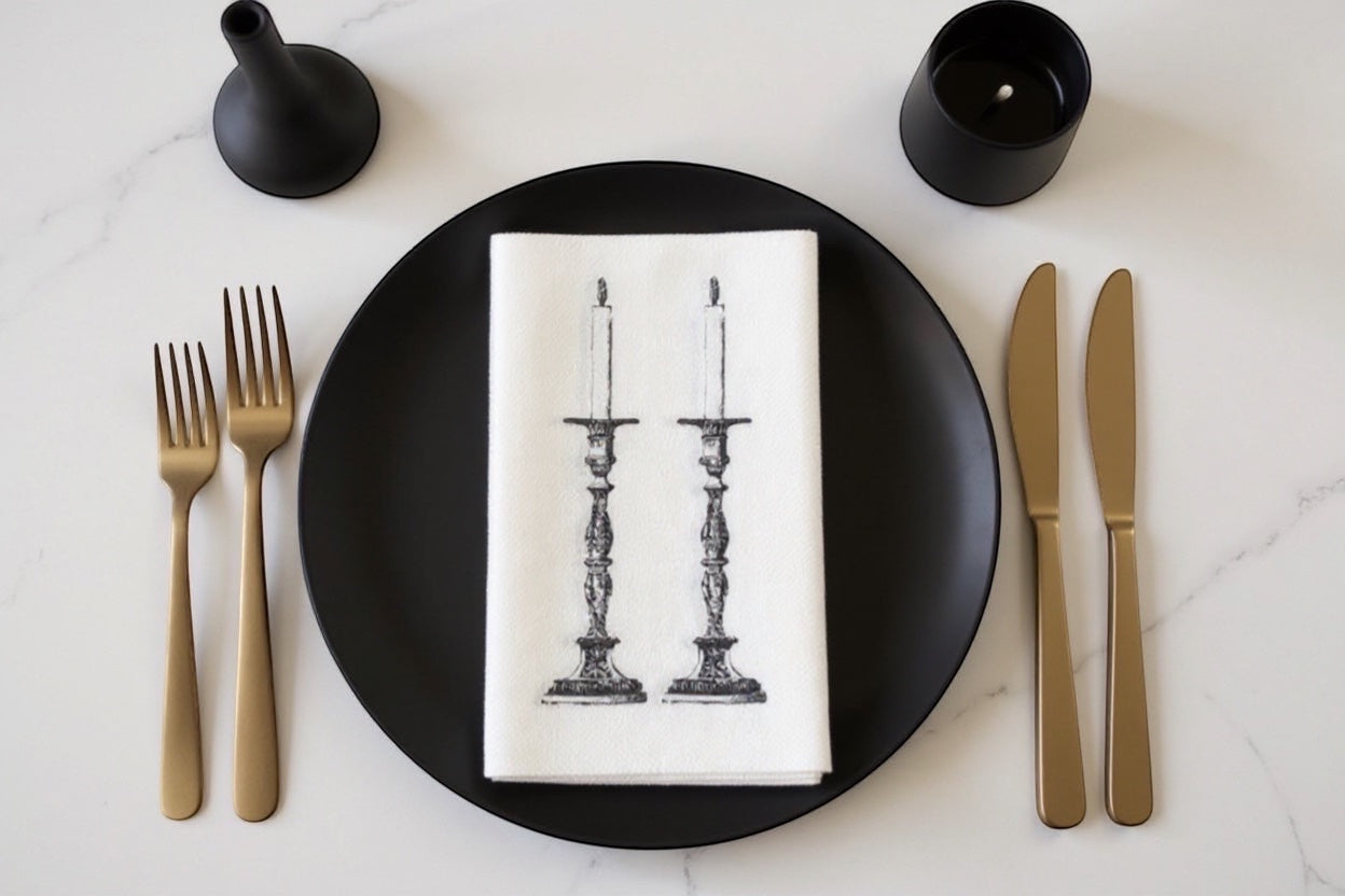 Eclectic Candlestick slimline disposable napkins with black ornate candle illustration on a white paper napkin