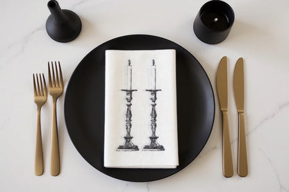 Eclectic Candlestick slimline disposable napkins with black ornate candle illustration on a white paper napkin