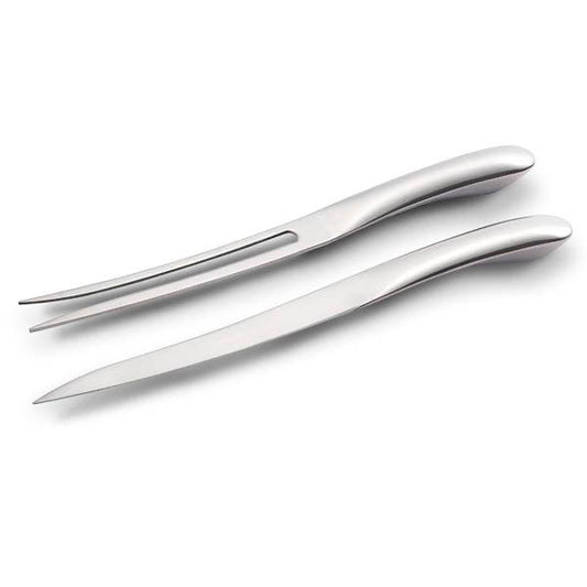 Eclectic Capri stainless steel slim carving knife and fork set with a sleek, modern silver finish.