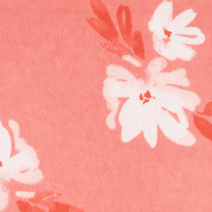 Eclectic Carter’s coral burp cloth with a delicate ivory floral blossom print on soft cotton interlock fabric.