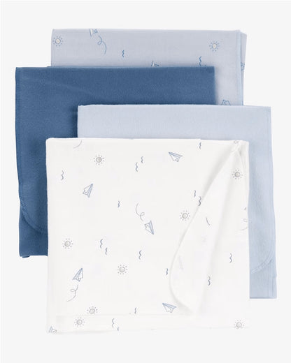 Eclectic Carter’s cotton muslin swaddle set in blue and white with paper plane and cloud prints for newborns.