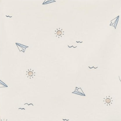 Eclectic Carter’s ivory cotton burp cloth with blue paper plane and sun print pattern