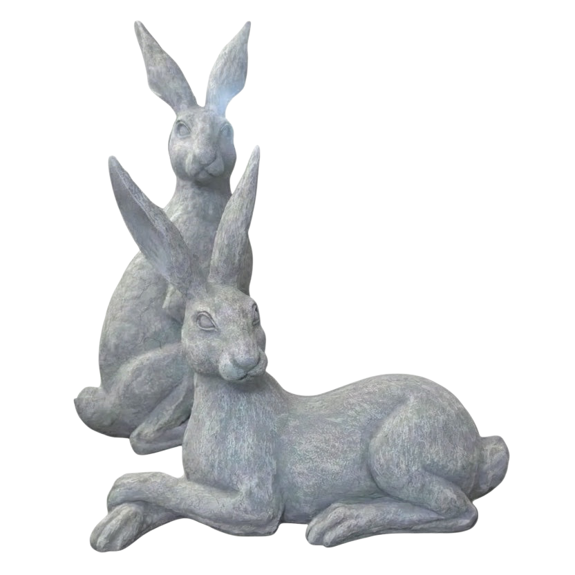 Eclectic Humphrey & Harriet cement hare garden sculptures in a weathered stone grey finish with detailed textures.