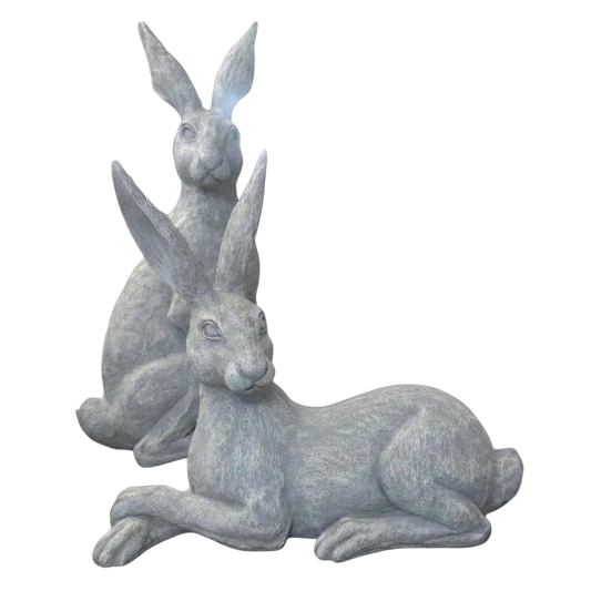 Eclectic Humphrey & Harriet cement hare garden sculptures in a weathered stone grey finish with detailed textures.